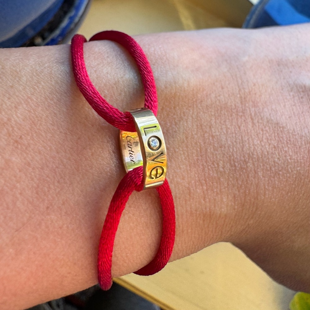 18k pink gold diamond Cartier Charity Love adjustable cord bracelet.